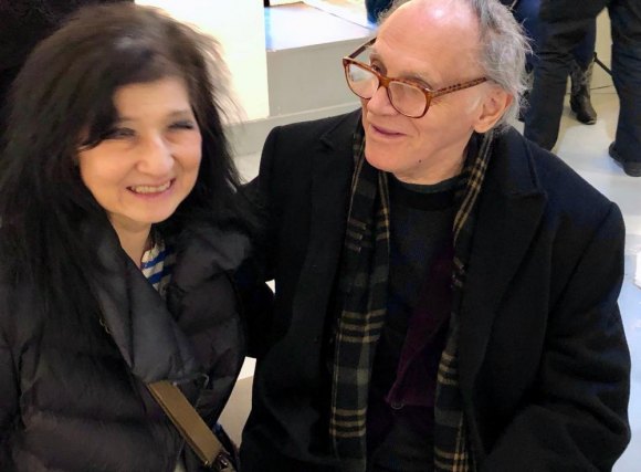 With Vernissage XVIII, RIVAA Returns In Style RIVAA's guiding spirit Valeriu Boborelu (R) chats with Toshiko Kitano Groner who will solo in the gallery in June.